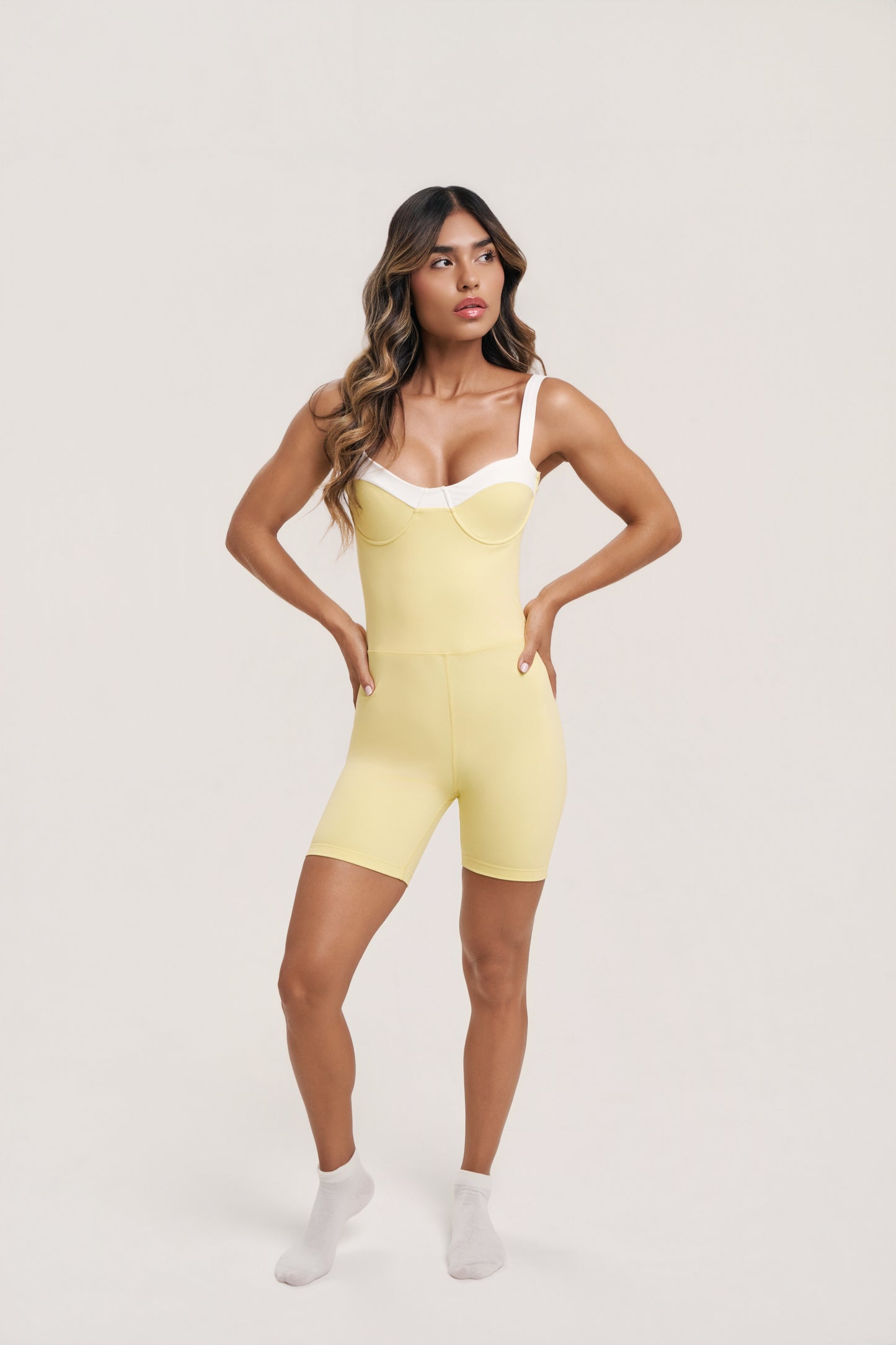 Gaia Romper | Women’s Black and White Workout Romper – Underwire Pilates Romper with Twist Back