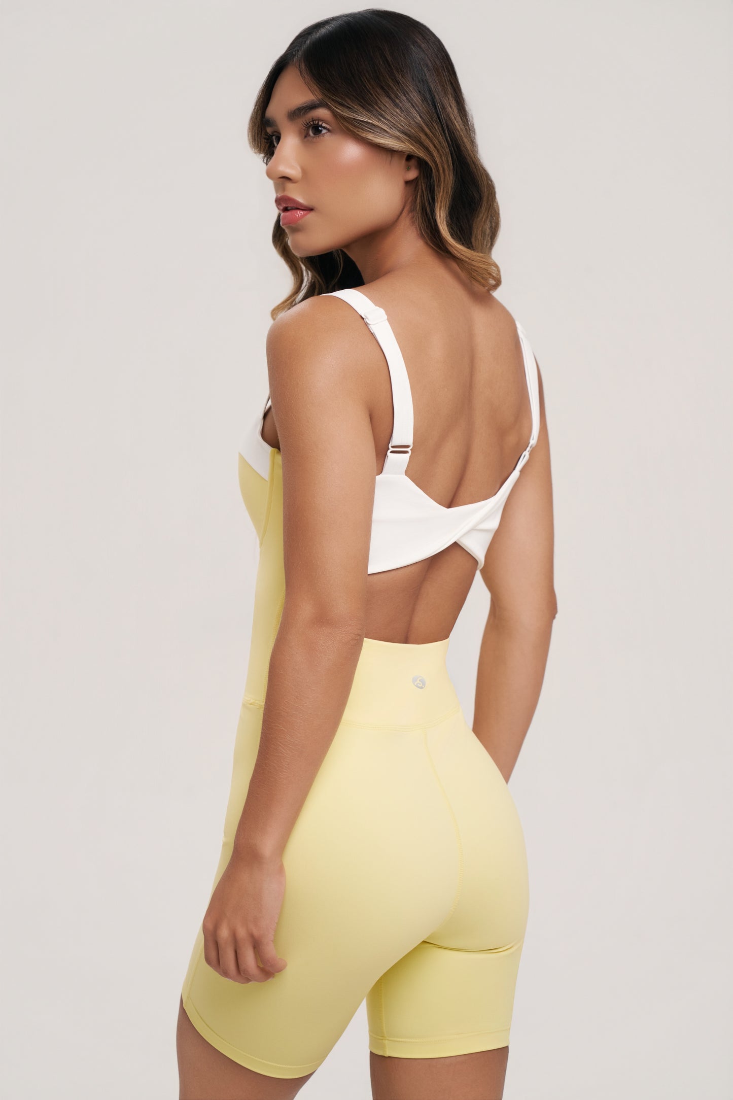 Gaia Romper | Women’s Black and White Workout Romper – Underwire Pilates Romper with Twist Back